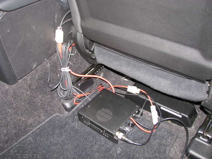 Remote unit mounted under passenger seat